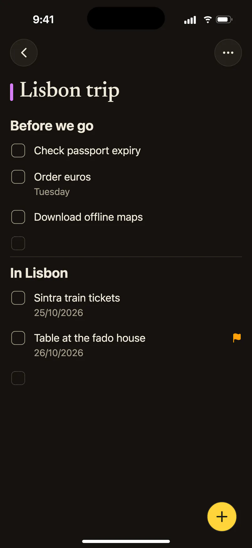A reminders list called Lisbon trip on iPhone, in two sections.